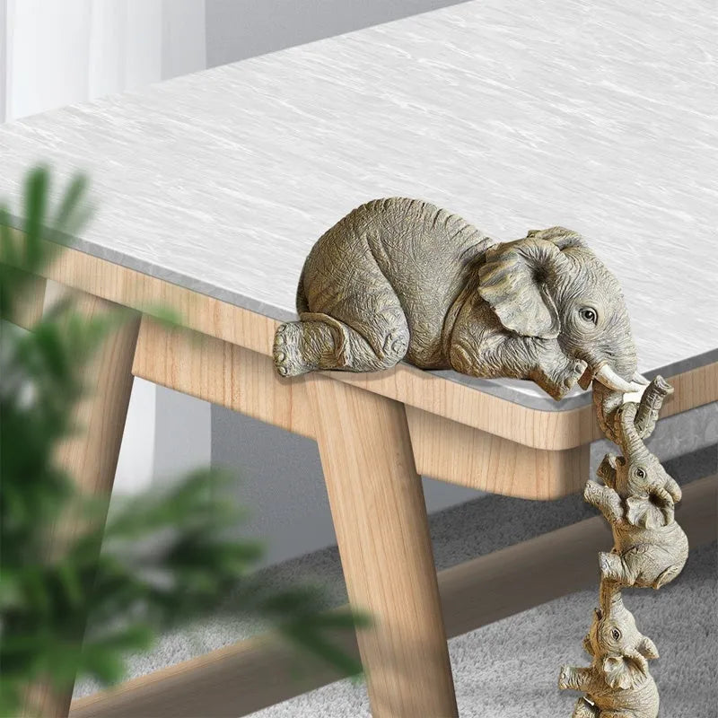 Resin mother elephant figurine with baby elephant, 10cm and 5cm tall, set in protective packaging