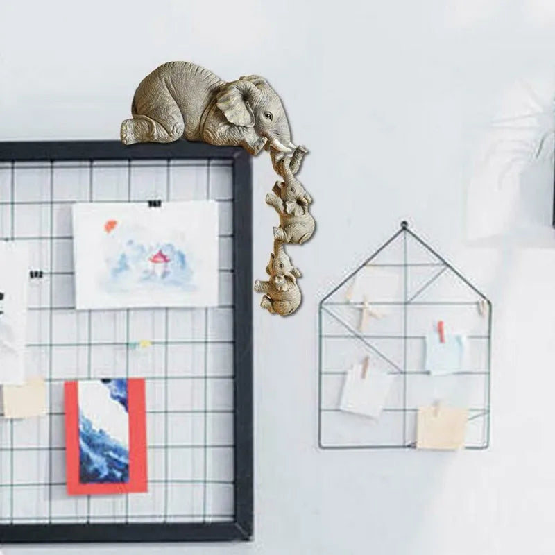 Resin mother elephant figurine with baby elephant, 10cm and 5cm tall, set in protective packaging