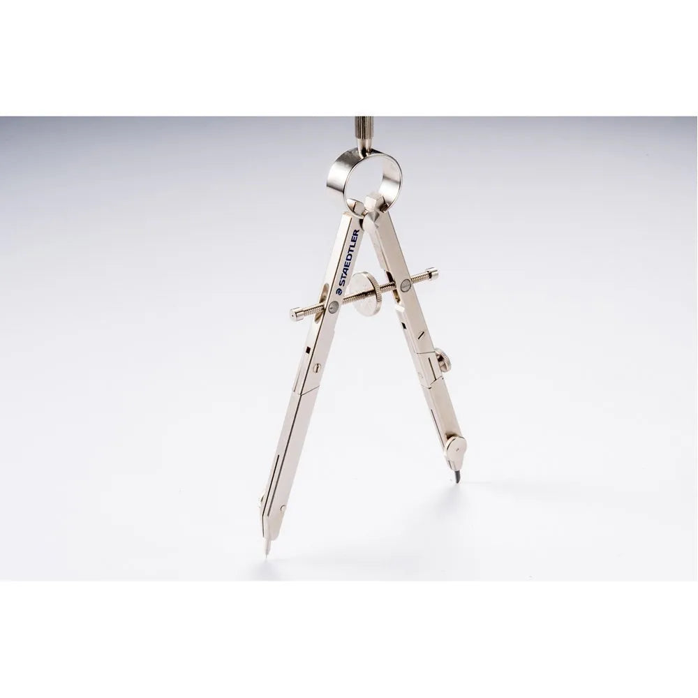 STAEDTLER 551 01 steel car compass with extended telescopic rod on drafting paper.