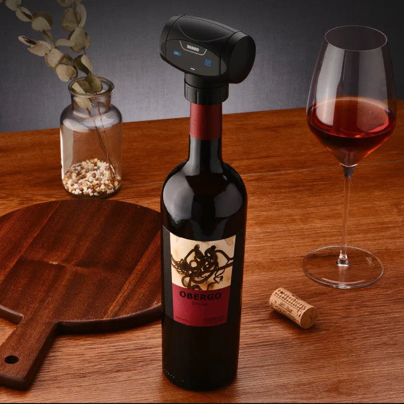 Black electric rechargeable vacuum wine stopper with metal construction and storage bag.