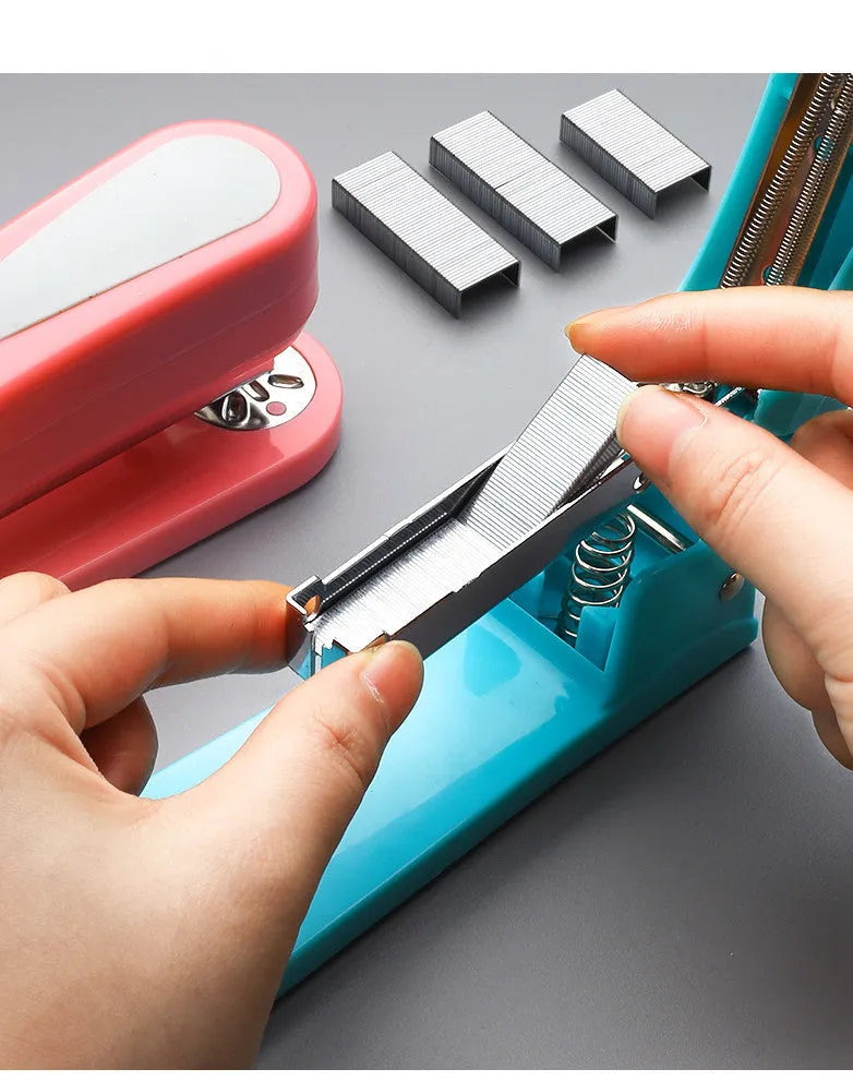 Rotatable student stapler shown in blue, demonstrating 360-degree rotation and centre seam paper binding.
