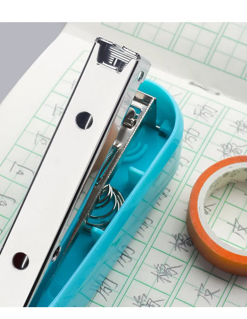 Black rotatable desktop stapler shown with head rotated, demonstrating 90mm deep throat for centre binding.
