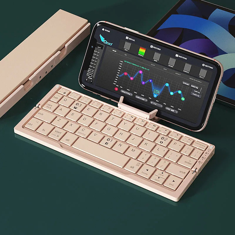 Silver white folding Bluetooth keyboard open with stand holding a smartphone, shown next to its compact folded size.