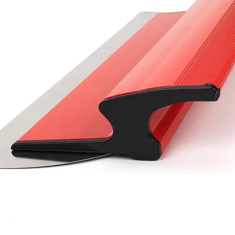 Red leveling scraper tool with a long 40 cm metal blade for wall putty and wallpaper work.