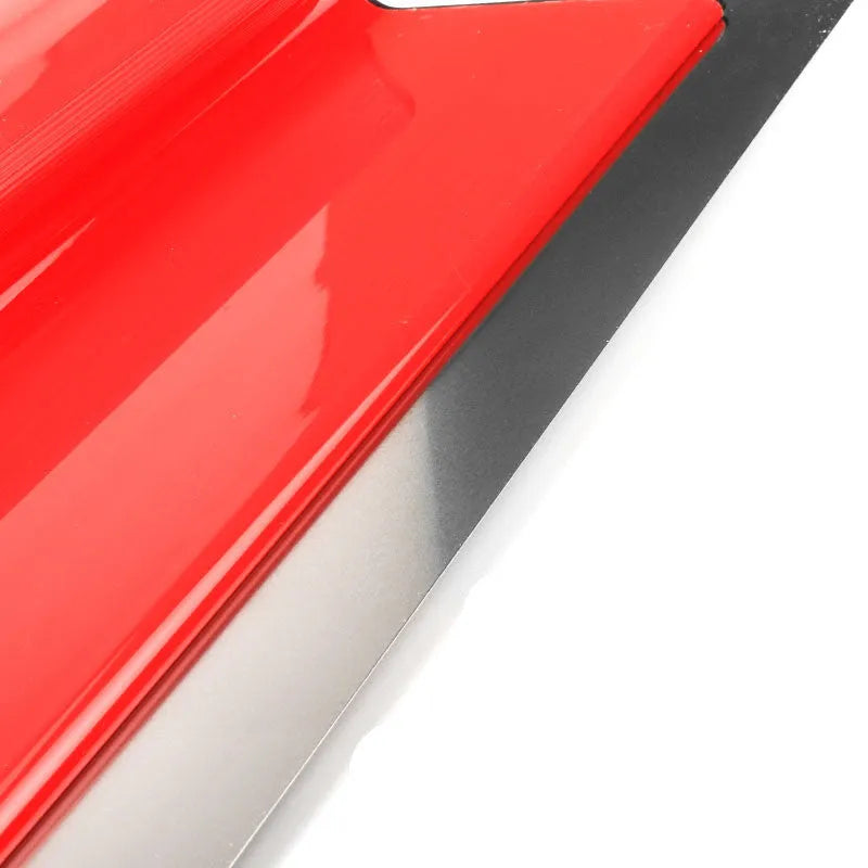 Red leveling scraper tool with a long 40 cm metal blade for wall putty and wallpaper work.