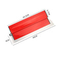 Red leveling scraper tool with a long 40 cm metal blade for wall putty and wallpaper work.