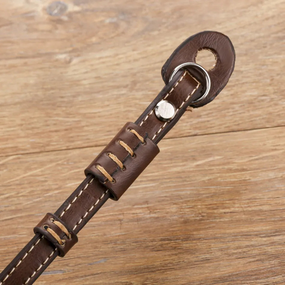 Black camera wrist strap with metal connectors for DSLR and mirrorless cameras