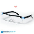 Transparent black USB LED light reading glasses on a table, showing the integrated light and frame.