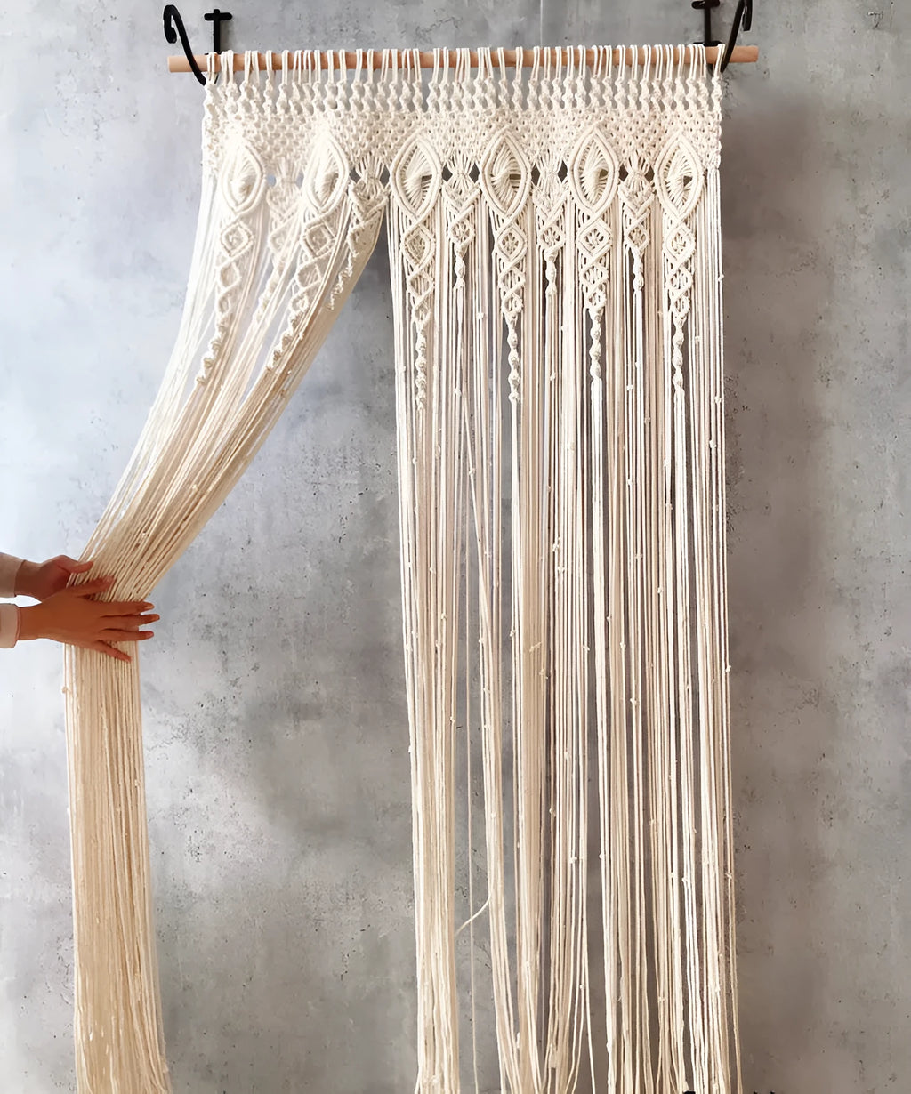 White perforated woven partition curtain with tassel trim, available in four sizes for doorways and windows.