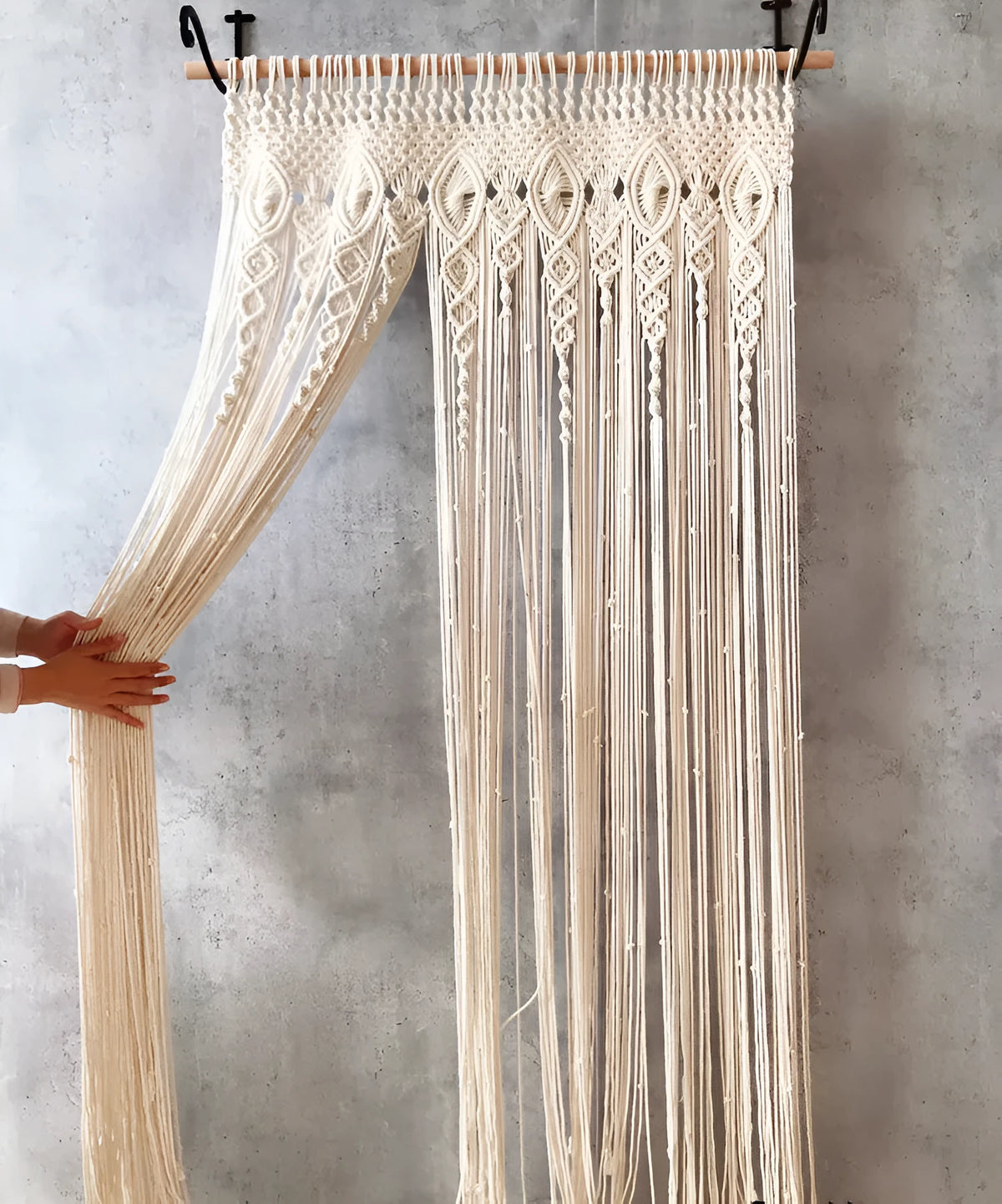 White perforated woven partition curtain with tassel trim, available in four sizes for doorways and windows.