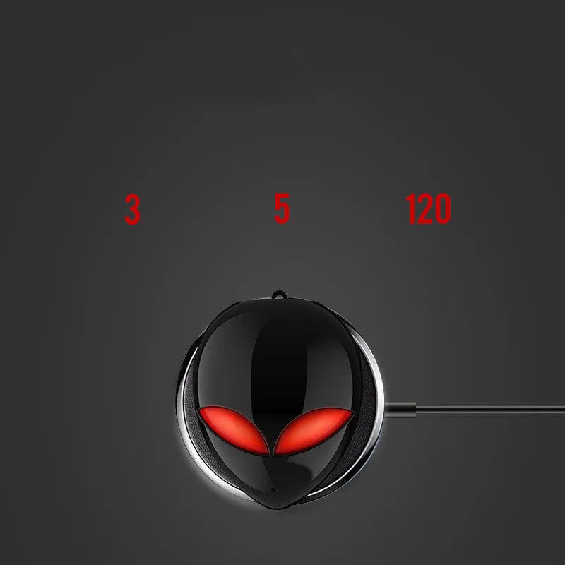 Creative Outer T8 Starman alien design Bluetooth earbuds with LED lights next to wireless charging case.