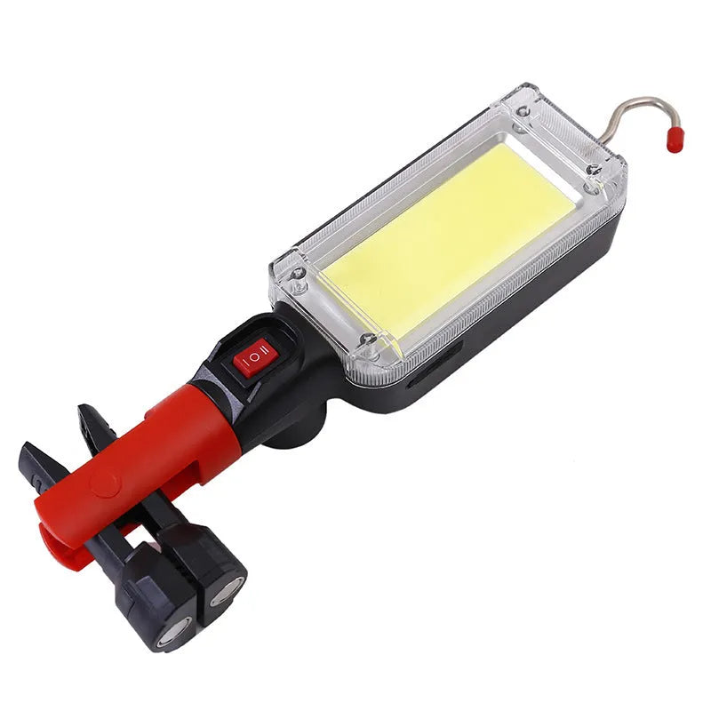 Black portable COB LED flashlight with magnetic base and USB charging port.