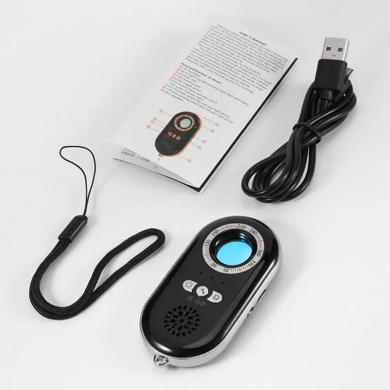 Compact black wireless signal detector for detecting hidden cameras and use as a vibration alarm.