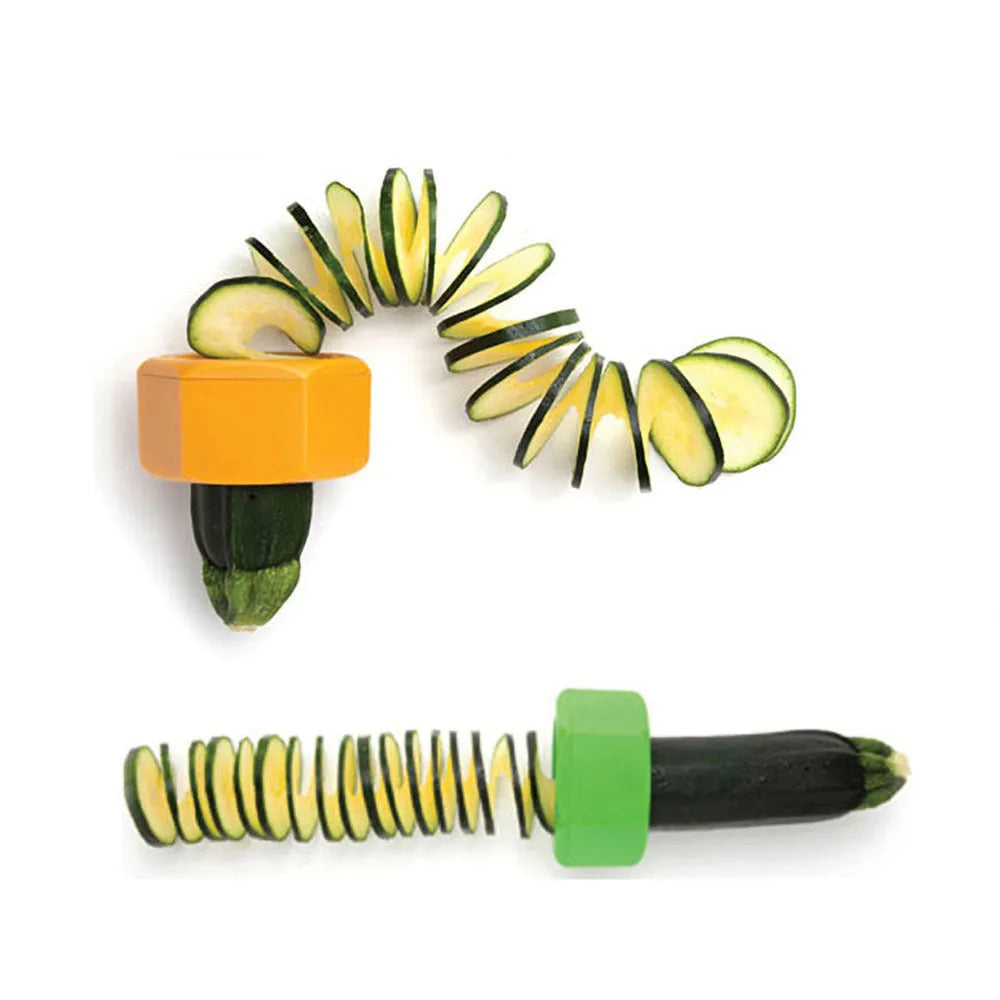 Yellow and green plastic spiral vegetable cutter and cucumber slicer kitchen gadget.