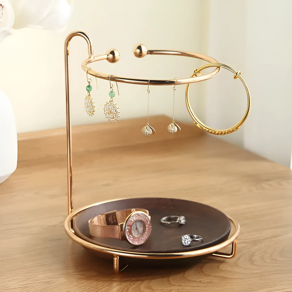 Walnut-coloured solid wood jewellery rack with metal hooks, measuring 21cm wide.