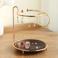 Walnut-coloured solid wood jewellery rack with metal hooks, measuring 21cm wide.