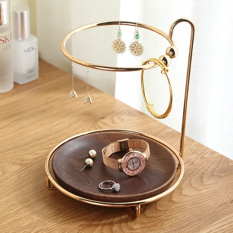 Walnut-coloured solid wood jewellery rack with metal hooks, measuring 21cm wide.