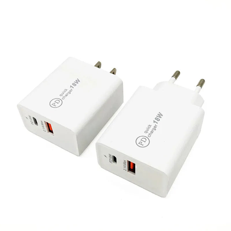 Compact white 18W USB-C fast wall charger with US plug pins on a wooden surface.