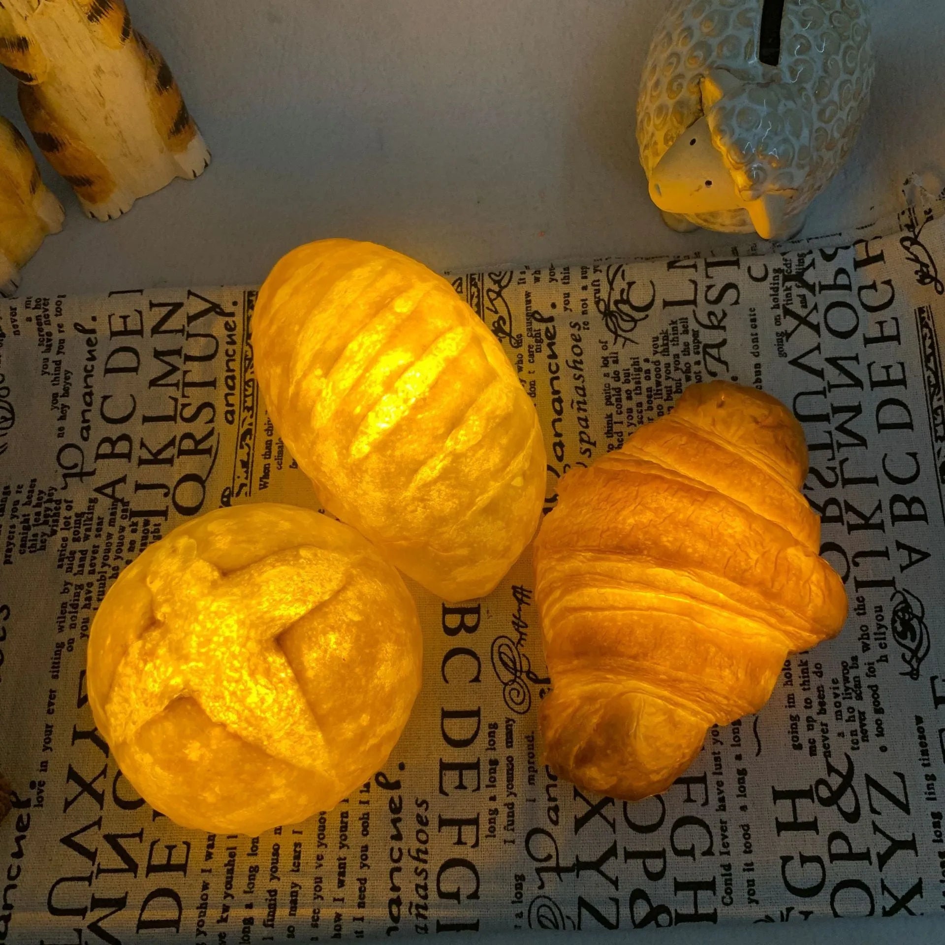 Creative LED night light shaped like a croissant or bread on a table