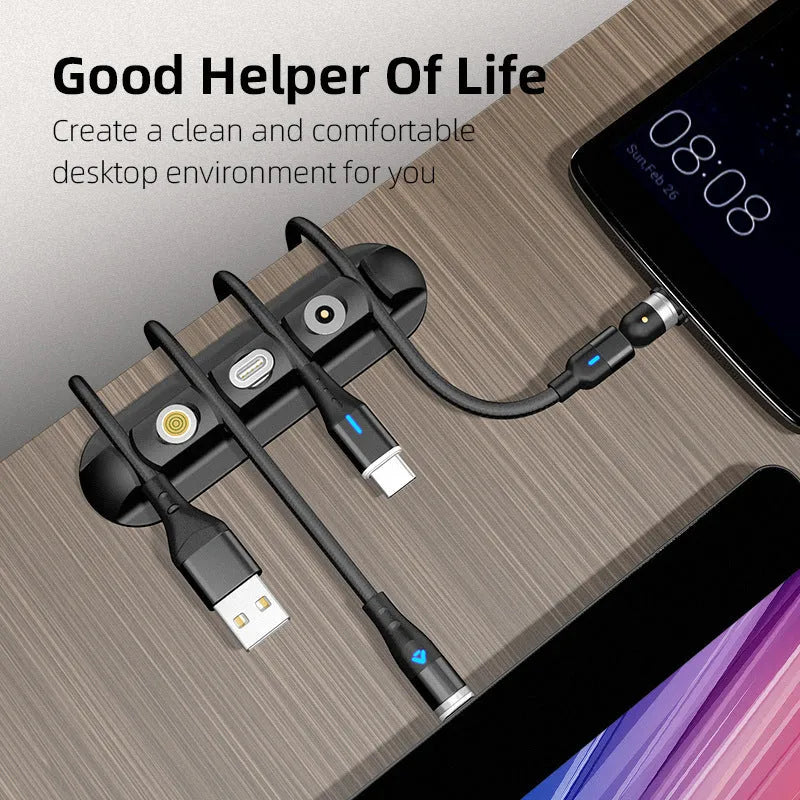 Black soft plastic desktop organiser holding a magnetic charging cable in place.