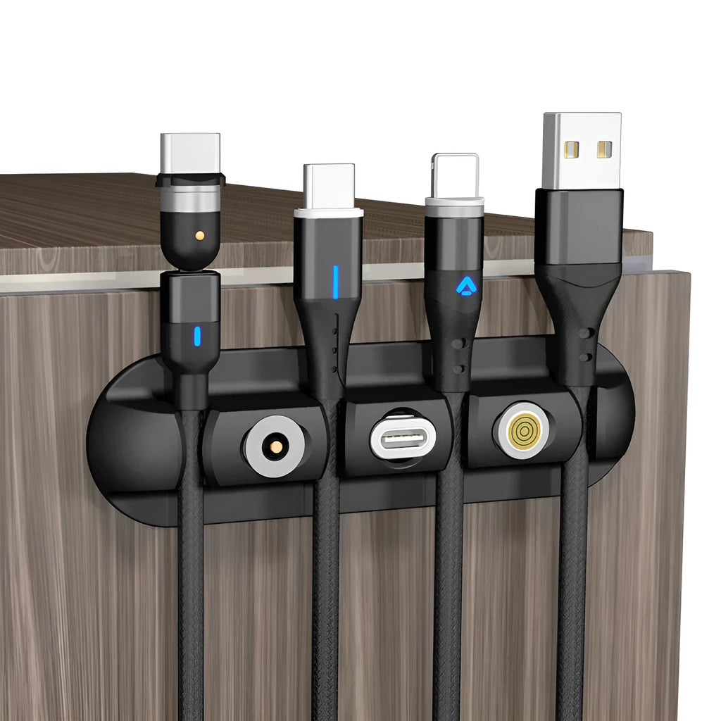 Black soft plastic desktop organiser holding a magnetic charging cable in place.