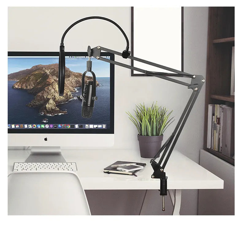 Black USB condenser microphone on a metal stand with a foam sponge cover, cable, and manual.