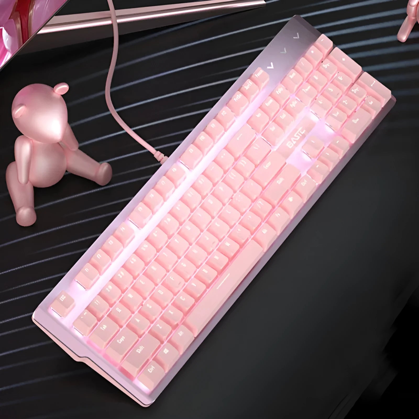 Pink mechanical keyboard and matching wired mouse set for PC gaming on a desk
