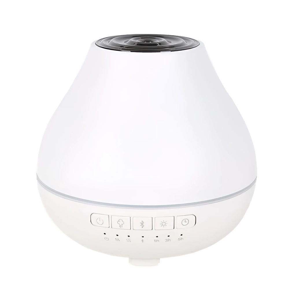 White round Bluetooth humidifier and aroma diffuser with night light on a wooden table, emitting mist.