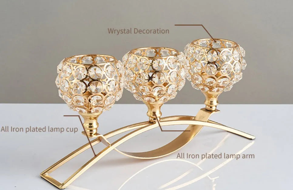 Geometric crystal candle holder with gold electroplated wrought iron frame on a table