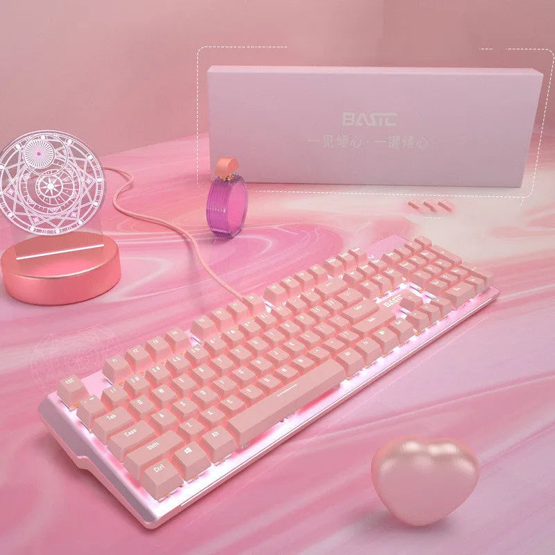 Pink mechanical keyboard and matching wired mouse set for PC gaming on a desk