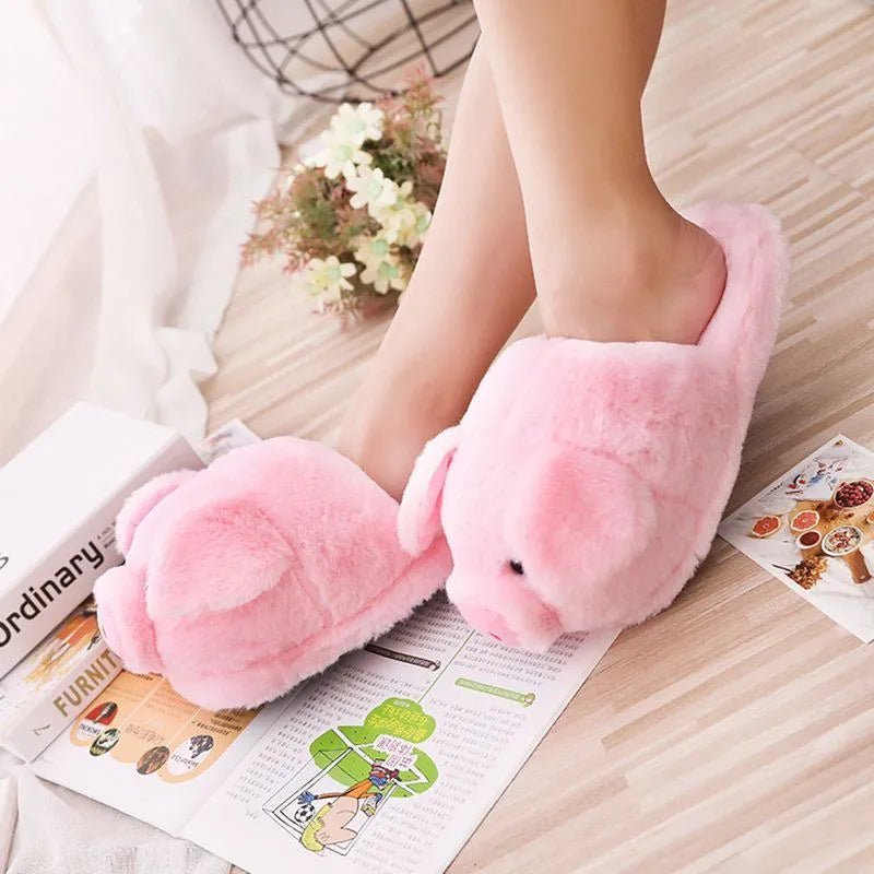 Women's warm winter house slippers in pink plush with animal pig design and PP cotton filling