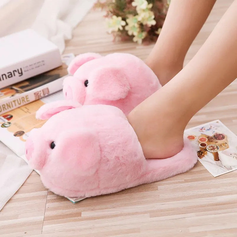 Women's warm winter house slippers in pink plush with animal pig design and PP cotton filling