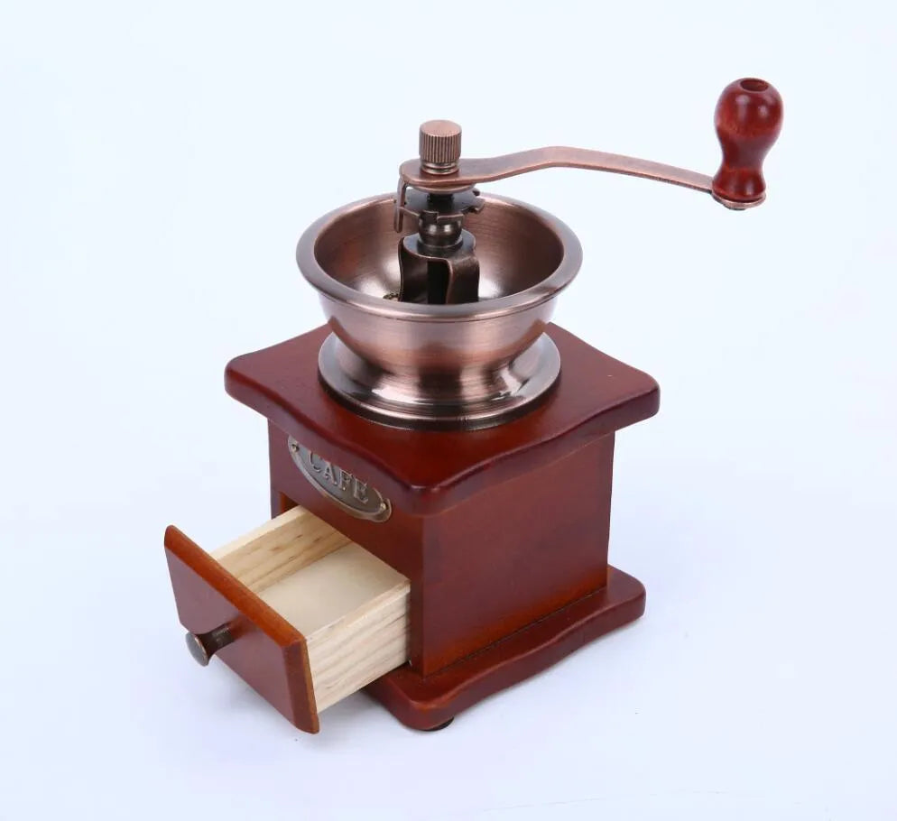Red manual coffee grinder with pine wood, cast iron and ceramic parts, 10x10x17cm, for 2-3 servings.