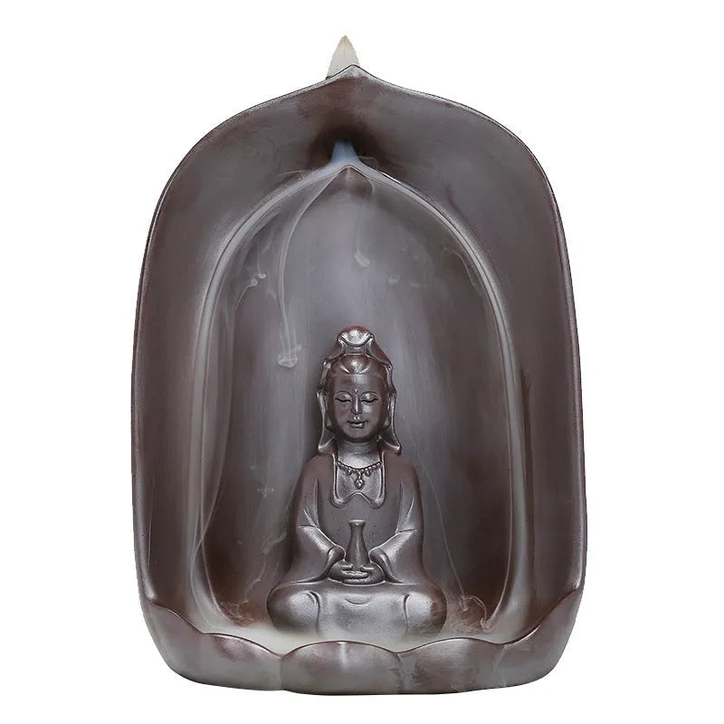 Handmade ceramic Guanyin Sitting Lotus statue with integrated back flow incense burner on a wooden table.