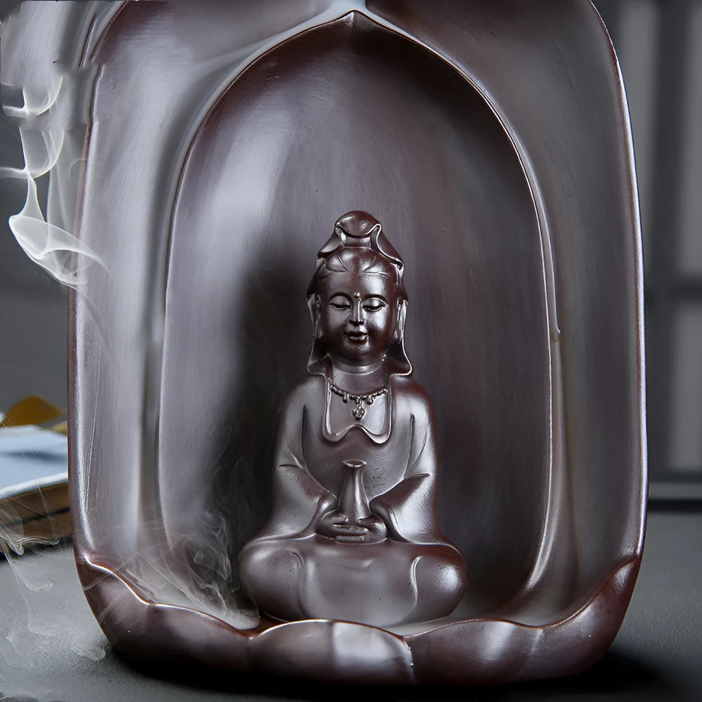 Handmade ceramic Guanyin Sitting Lotus statue with integrated back flow incense burner on a wooden table.