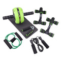Green resistance band and push-up bar abdominal power fitness set on a floor.