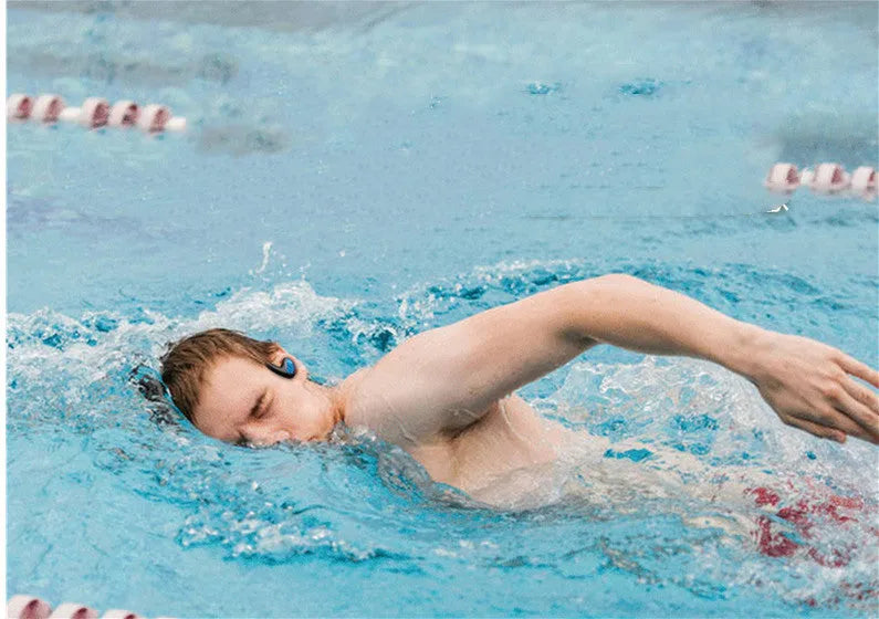 Black waterproof Bluetooth swimming headset with dual earpieces and head-mounted design for pool and running use