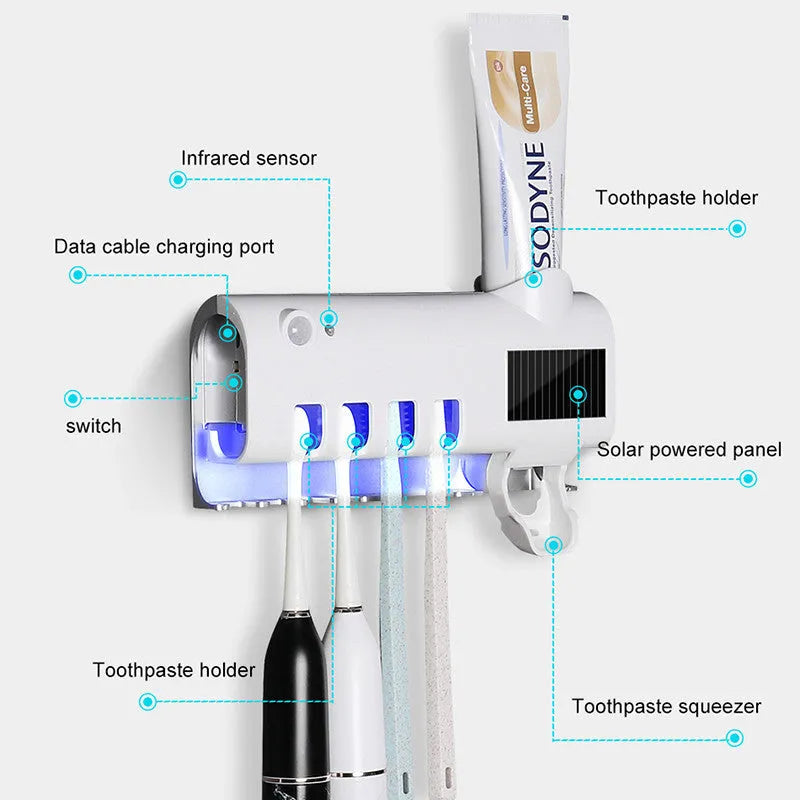 Black wall-mounted UV toothbrush steriliser with automatic toothpaste squeezer on bathroom tiles
