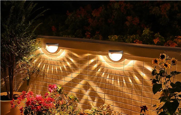 Solar wall light with water drop design, casting light and shadow at night, IP55 waterproof