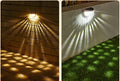 Solar wall light with water drop design, casting light and shadow at night, IP55 waterproof