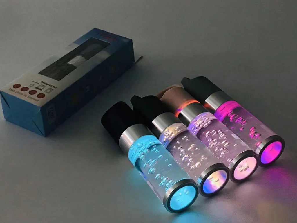 Colourful portable Bluetooth speaker with crystal light feature in pink, black, silver grey, or green.