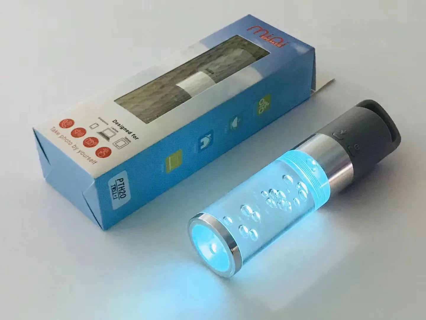 Colourful portable Bluetooth speaker with crystal light feature in pink, black, silver grey, or green.