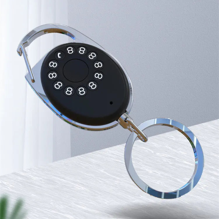 Black ABS plastic Bluetooth anti-lost tracker keychain with metal loop, shown with phone and keys.