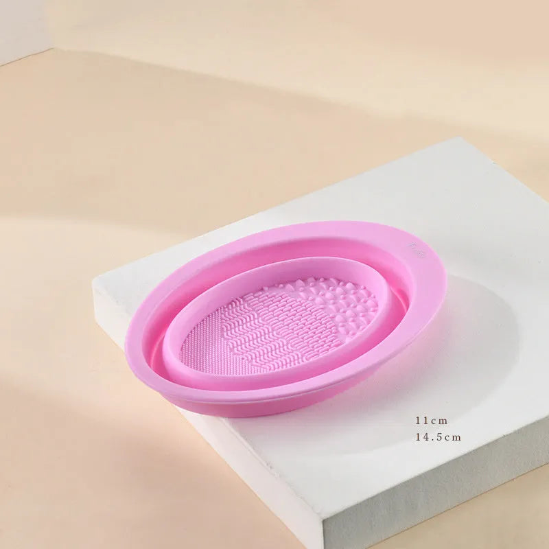 Silicone foldable makeup brush cleaning bowl with textured scrubbing plate in pastel pink