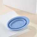 Silicone foldable makeup brush cleaning bowl with textured scrubbing plate in pastel pink