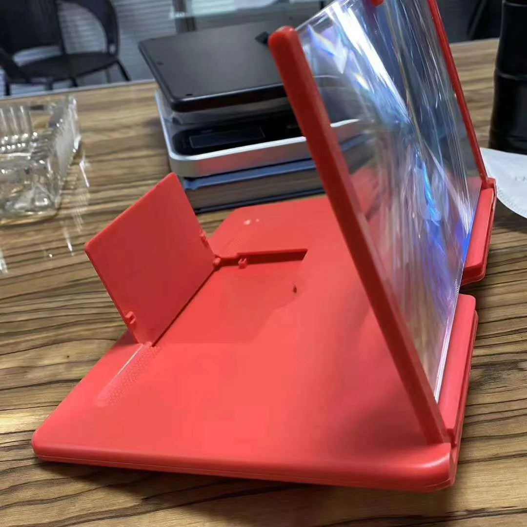 Acrylic lens phone screen magnifier with a smartphone in place, in black, white, and red