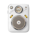 Compact green FM Four in One Smart Bluetooth Speaker with integrated radio on a table.