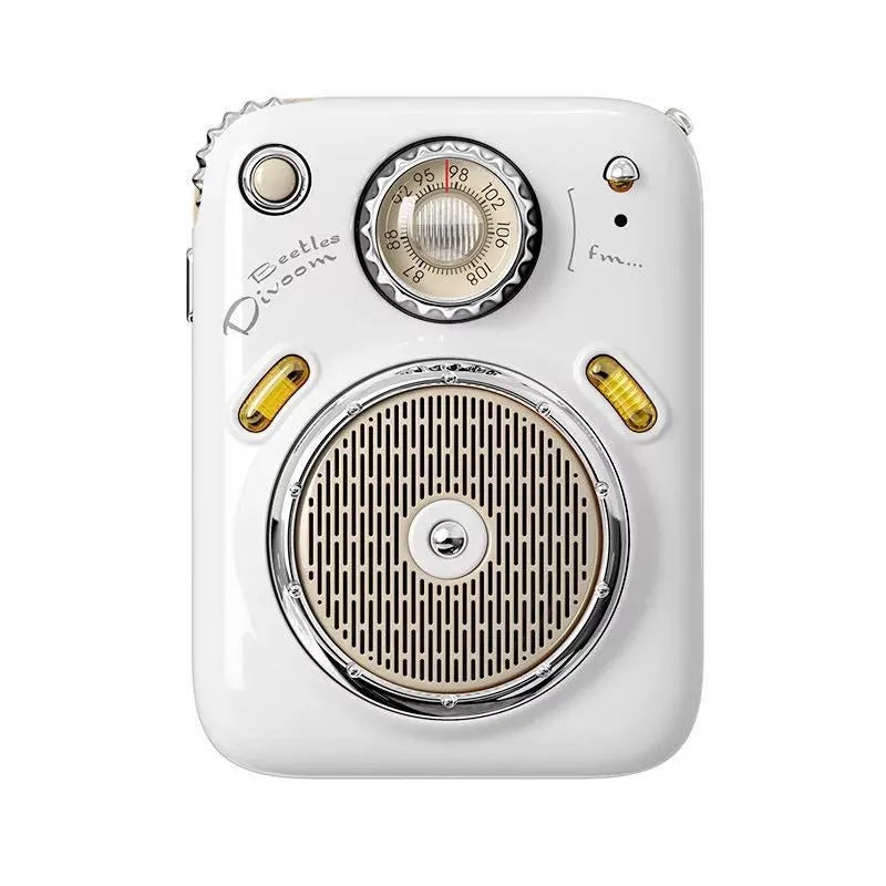 Compact green FM Four in One Smart Bluetooth Speaker with integrated radio on a table.