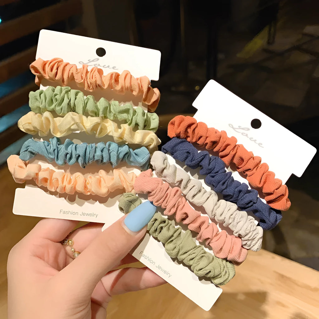 Children's hair ring and head rope set showing 20-piece and 6-piece dark packs in various colours.