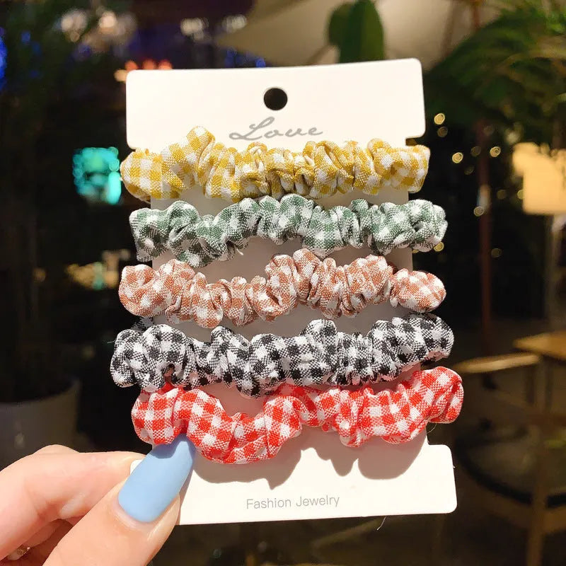 Children's hair ring and head rope set showing 20-piece and 6-piece dark packs in various colours.
